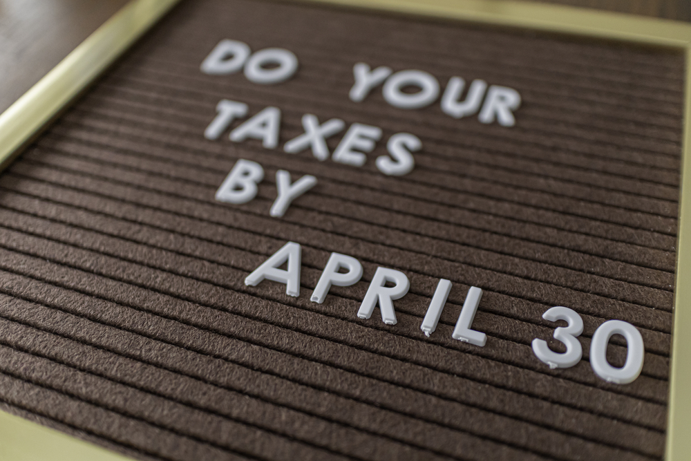 Letter board saying "Do Your Taxes by April 30"