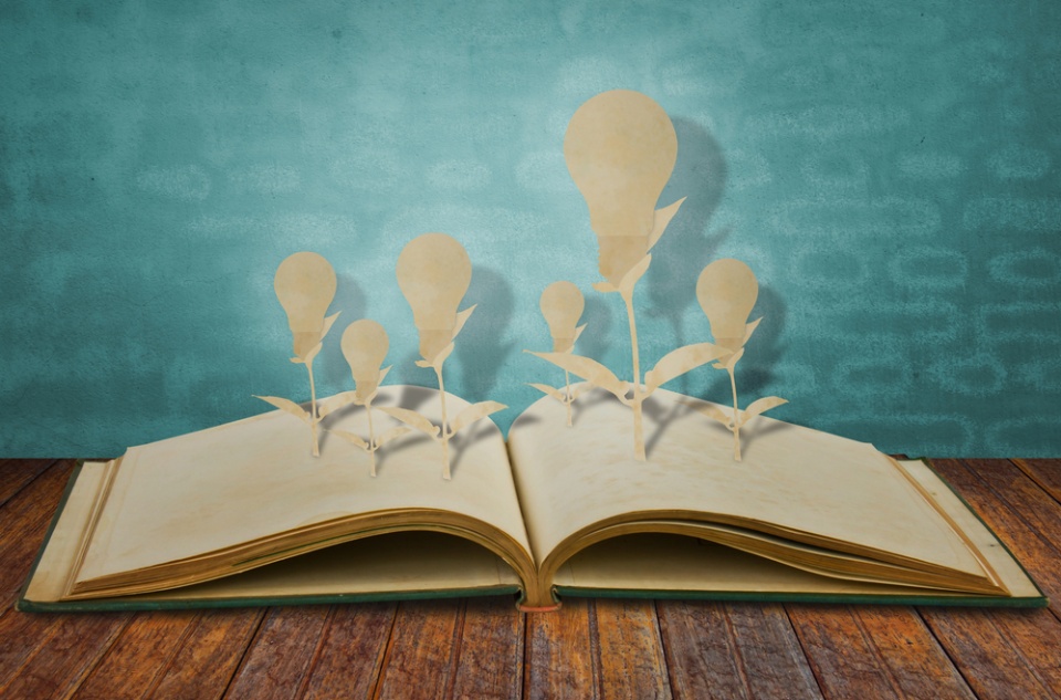 books for entrepreneurs (open book with bulb ideas growing out of it)