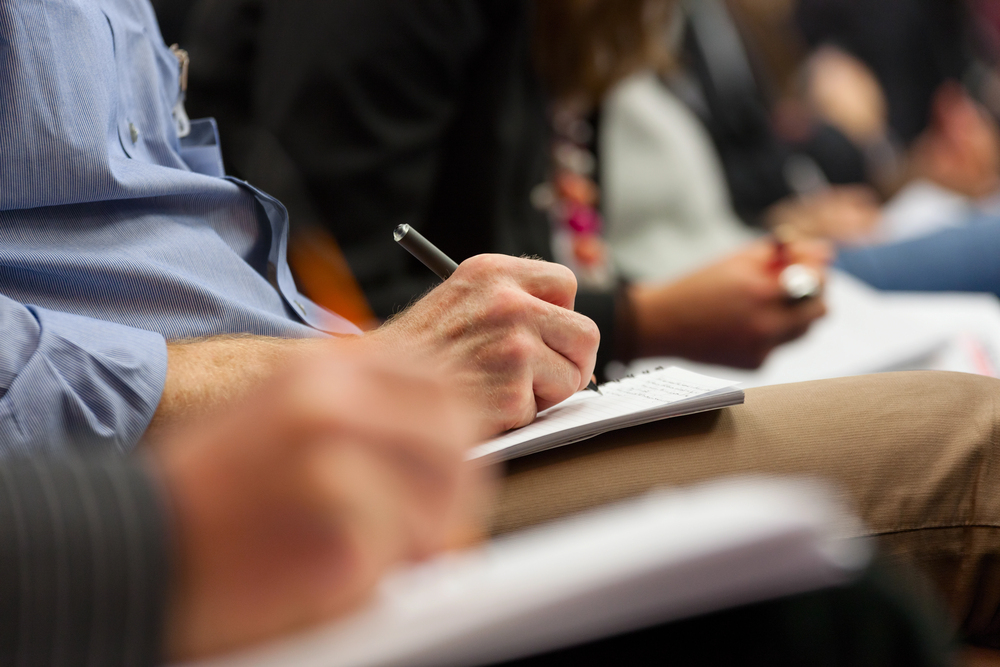 hand holding pen and writing